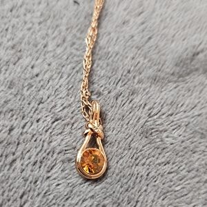 Radiant Gold Necklace with Orange Gemstone